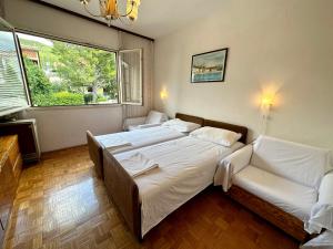 Postel nebo postele na pokoji v ubytování APARTMAN NENO
