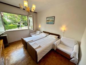 Postel nebo postele na pokoji v ubytování APARTMAN NENO