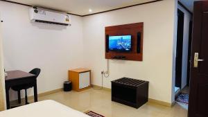 TV a/nebo společenská místnost v ubytování Star Dahlia Hotel + 15 fotografií