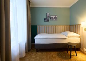 Łóżko lub łóżka w pokoju w obiekcie Hotel Limmathof