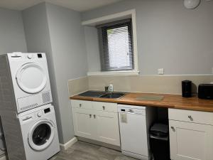 Kuchyň nebo kuchyňský kout v ubytování Sea Breeze Apartment Wick