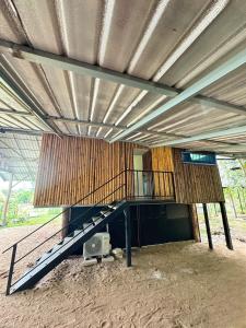 a building with a staircase in the middle of it at The Forest - Sell the Experience in Pai