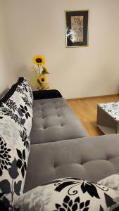 a living room with a couch and a table at Quiet place apartman Markovic in Požarevac