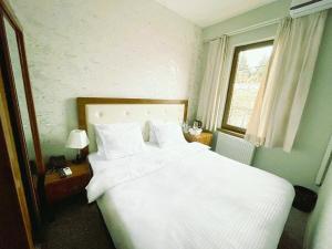 Postel nebo postele na pokoji v ubytování The Rogashome
