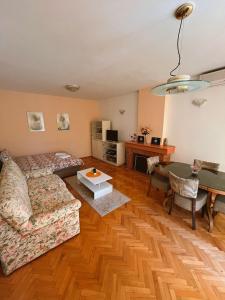 a living room with a couch and a table at Eleni Apartments in Gevgelija