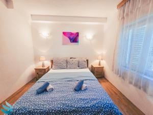 Postel nebo postele na pokoji v ubytování Hvar apartmani & spa