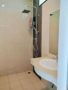 a bathroom with a sink and a shower at Jigsaw Cafe & Resort in Ban Na We +44 photos