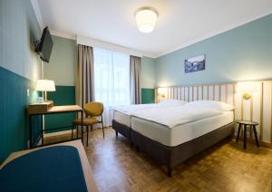 Łóżko lub łóżka w pokoju w obiekcie Hotel Limmathof