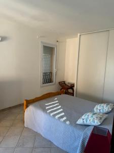 Postel nebo postele na pokoji v ubytování villa arbutu