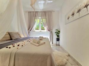 Posteľ alebo postele v izbe v ubytovaní Elite Residence Flos