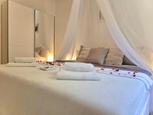 Posteľ alebo postele v izbe v ubytovaní Elite Residence Flos