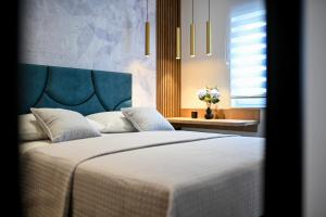 Posteľ alebo postele v izbe v ubytovaní Apartments and Rooms Nekic