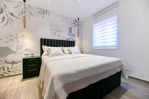 Posteľ alebo postele v izbe v ubytovaní Apartments and Rooms Nekic
