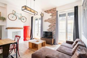 Et tv og/eller underholdning på Appartement 3 chambres en hyper centre de Grenoble