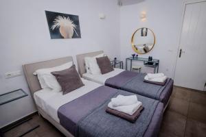 Posteľ alebo postele v izbe v ubytovaní Villa Artemis (Agios Lazaros, Psarou)