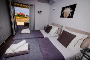 Posteľ alebo postele v izbe v ubytovaní Villa Artemis (Agios Lazaros, Psarou)
