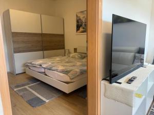 Postel nebo postele na pokoji v ubytování Apartments Zupan