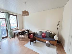 a living room with a couch and a table at Forest Charm and Gems in Idar-Oberstein