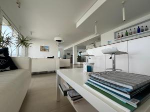 a living room with a couch and a table at B&B Le Maree in Marzamemi