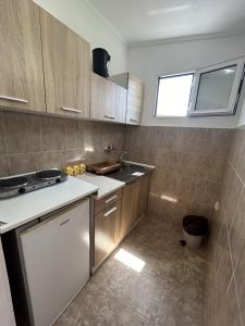 Kuchyň nebo kuchyňský kout v ubytování Apartments TODOR