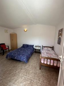 Postel nebo postele na pokoji v ubytování Apartments TODOR