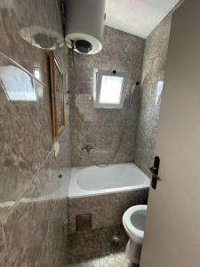 Koupelna v ubytování Apartments TODOR