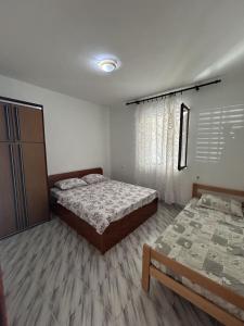 Postel nebo postele na pokoji v ubytování Apartments TODOR