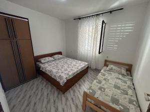 Postel nebo postele na pokoji v ubytování Apartments TODOR