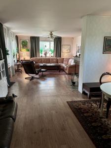 a living room with a couch and a table at Vallvikshuset in Vallvik