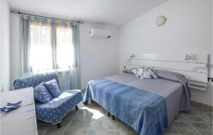 Ένα ή περισσότερα κρεβάτια σε δωμάτιο στο Stunning Home In Costa Paradiso