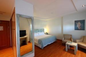 Łóżko lub łóżka w pokoju w obiekcie Gran Hotel Aqualange - Balneario de Alange