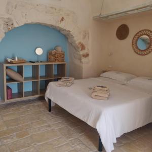 Postel nebo postele na pokoji v ubytování Trullo del Sol + 28 fotografií
