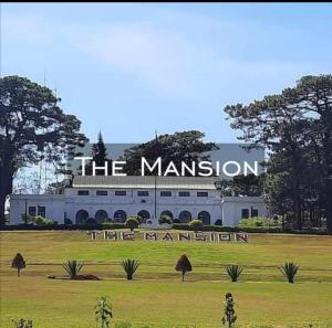 a building with the name of the manzanillo at Baguio Dreamz - Transient in Baguio