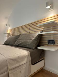 Postel nebo postele na pokoji v ubytování Design, comfort e atmosfera nel cuore del Salento