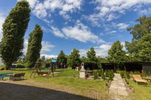 a park with a playground and a swing at Motel Home Wittenau Berlin in Berlin