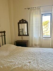 Posteľ alebo postele v izbe v ubytovaní Demetra House by Elefthia Syros + 10 fotografií