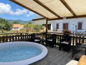 a hot tub on the patio of a house at Astra in Agerola