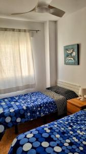 A bed or beds in a room at Hello Oliva Beach Ana Még 33 kép