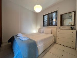 Postel nebo postele na pokoji v ubytování Queens Boutique Apartment 2BR