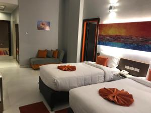 Postel nebo postele na pokoji v ubytování Gloria Aqua Park Hotel