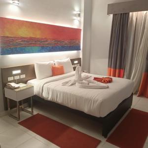 Postel nebo postele na pokoji v ubytování Gloria Aqua Park Hotel
