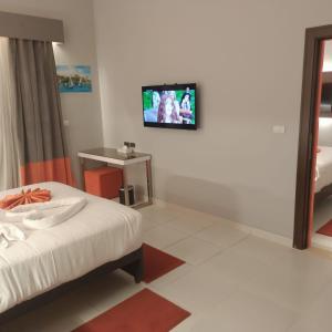 Postel nebo postele na pokoji v ubytování Gloria Aqua Park Hotel