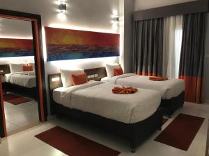 Postel nebo postele na pokoji v ubytování Gloria Aqua Park Hotel