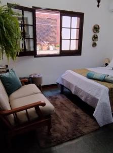 Hospedaria Canto do Vinhedo客房内的一张或多张床位