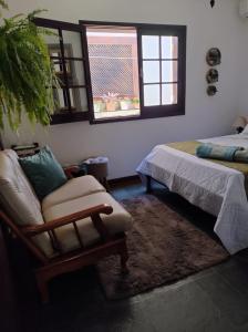 Hospedaria Canto do Vinhedo客房内的一张或多张床位