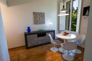 a living room with a white table and chairs at AF51 Florence Apartment in Florence