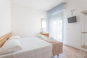 Postel nebo postele na pokoji v ubytování Hotel Katina