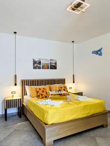 Postel nebo postele na pokoji v ubytování I colori della Sicilia