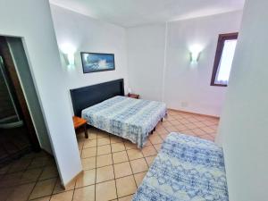A bed or beds in a room at Al Barcoco