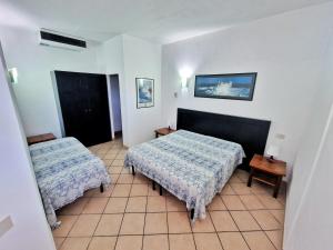 A bed or beds in a room at Al Barcoco